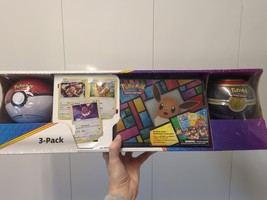 Pokemon Eevee Evolutions 3-Pack Treasure Chest Tin &amp; 2 PokeBalls - Costco  - $148.49