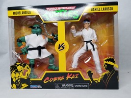 Teenage Mutant Ninja Turtles vs Cobra Kai-Michelangelo/Daniel Larusso Figures V8 - £23.80 GBP