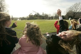 Children wave at Marine One helicopter leaving White House 2006 Photo Print - $8.81+