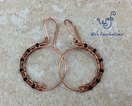 Handmade copper earrings: hoops half wire wrapped with matte black glass beads - $27.00