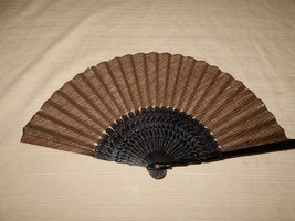 Lovely vintage black plastic folding fan with brown woven cloth interior - $12.00
