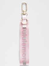 LULULEMON NEVER LOST KEYCHAIN REFLECTIVE BLISSFUL PINK/ CALYPSO PINK USP... - $47.95