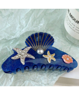 Sealife blue acrylic hair claw - $265.44 MXN