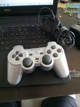 Silver sony ps2 controller - £17.74 GBP
