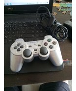 Silver sony ps2 controller - $22.44