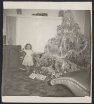 SNAPSHOT from ALBUM * LITTLE GIRL next TO BIG CHRISTMAS TREE  * 2-1/4 X ... - $8.95