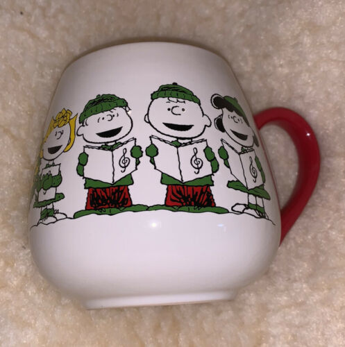 Primary image for Peanuts CHARLIE SNOOPY LUCY SALLY LINUS Christmas Caroling Mug 20oz Cup NEW 4”