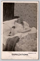 RPPC Bamforth Little Girl Breakfast In Bed With Puppy Expectations Postcard S27 - £7.89 GBP
