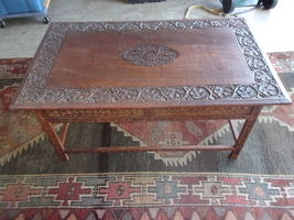 solid wood hand carved coffee table with folding legs 40x24x19 - $275.00