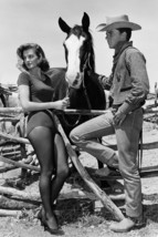 Angie Dickinson and Ricky Nelson in Rio Bravo on set 18x24 Poster - £19.29 GBP