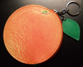 An Orange Key Chain A Soft Material with Zippered Pouch and Green Leaf Accent - $7.99