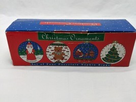 Christmas Ornaments Set Of Four Porcelain Napkin Rings Santa Clause - £31.60 GBP