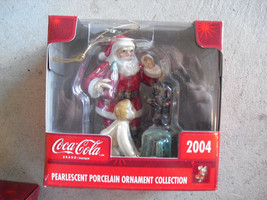 2004 Coca Cola Pearlescent Porcelain Santa with Dog Christmas Ornament NIB - $16.83