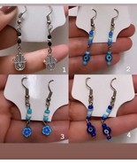 Evil eye dangle drop earrings hand of Hamsa polymer flower details beade... - $285.10 MXN