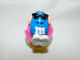 M Ms Blue Relaxing in Pink Easter Egg Topper 2 Inches Tall 1998 - $5.99