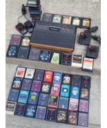 vintage Atari 2600 Console &amp; 58 games lot 1980&#39;s joysticks paddles Untested - $219.99