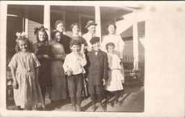 RPPC Sweet Family Photo Girls Bows Boy Eating Apple Nice Smiles Postcard Z20 - £9.40 GBP