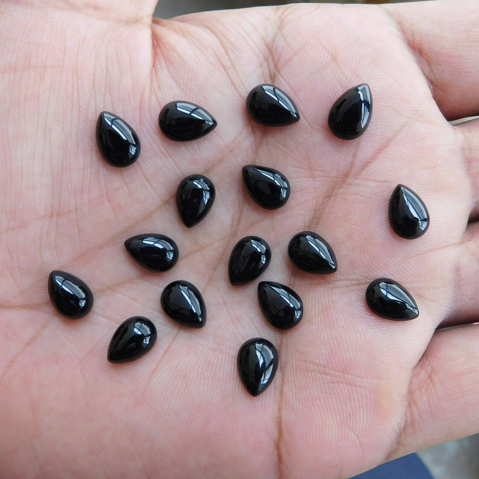 Primary image for GTL certificate 7x10 mm pear onyx black cabochon gemstone wholesale 100 piece a1