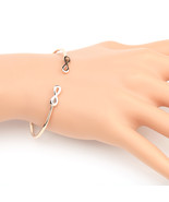 Rose Gold Tone Bangle Bracelet With Contemporary Infinity Design - $31.42 CAD