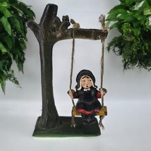 Vintage Cast Iron Figurine Hand Painted Amish Girl on Tree Swing with Squirrel - $10.60