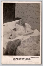 RPPC Bamforth Little Girl Breakfast In Bed With Puppy Expectations Postcard S27 - £7.97 GBP