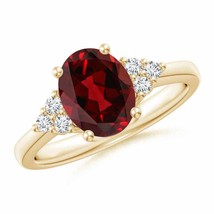 ANGARA Solitaire Oval Garnet Ring with Trio Diamond Accents in 14K Gold - £1,033.34 GBP