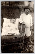 RPPC Darling Barefoot Boys Wicker Rocking Chair Photo in Yard Postcard H21 - £6.24 GBP