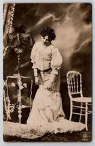 RPPC Pretty Woman Removing Skirt  in Fancy Studio Dark Clouds c1907 Postcard E25 - £23.94 GBP