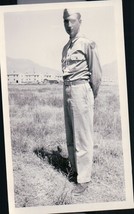 Vintage Soldier Standing in Grass Apartments In The Background  Snapshot... - $4.99