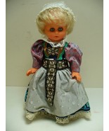 Vintage Porcelain Doll Girl in Colorful Dress Blonde Hair Closing Blue Eyes - $12.74