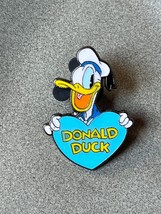Disney Trading Collector’s Enamel Donald Duck Holding Blue Heart Oxidized Silver - £7.60 GBP