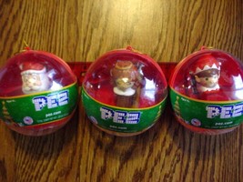 (3) Christmas Pez In plastic Balls-Unopened Santa/Angel and Elf - $8.00