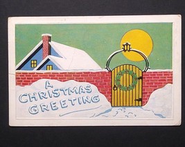 A Christmas Greeting Wreath Brick Wall House in Snow Embossed Postcard c... - $6.99