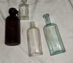 Lot of 4 Vintage Medicine Bottles Clear Brown Aqua Bitters - £15.62 GBP