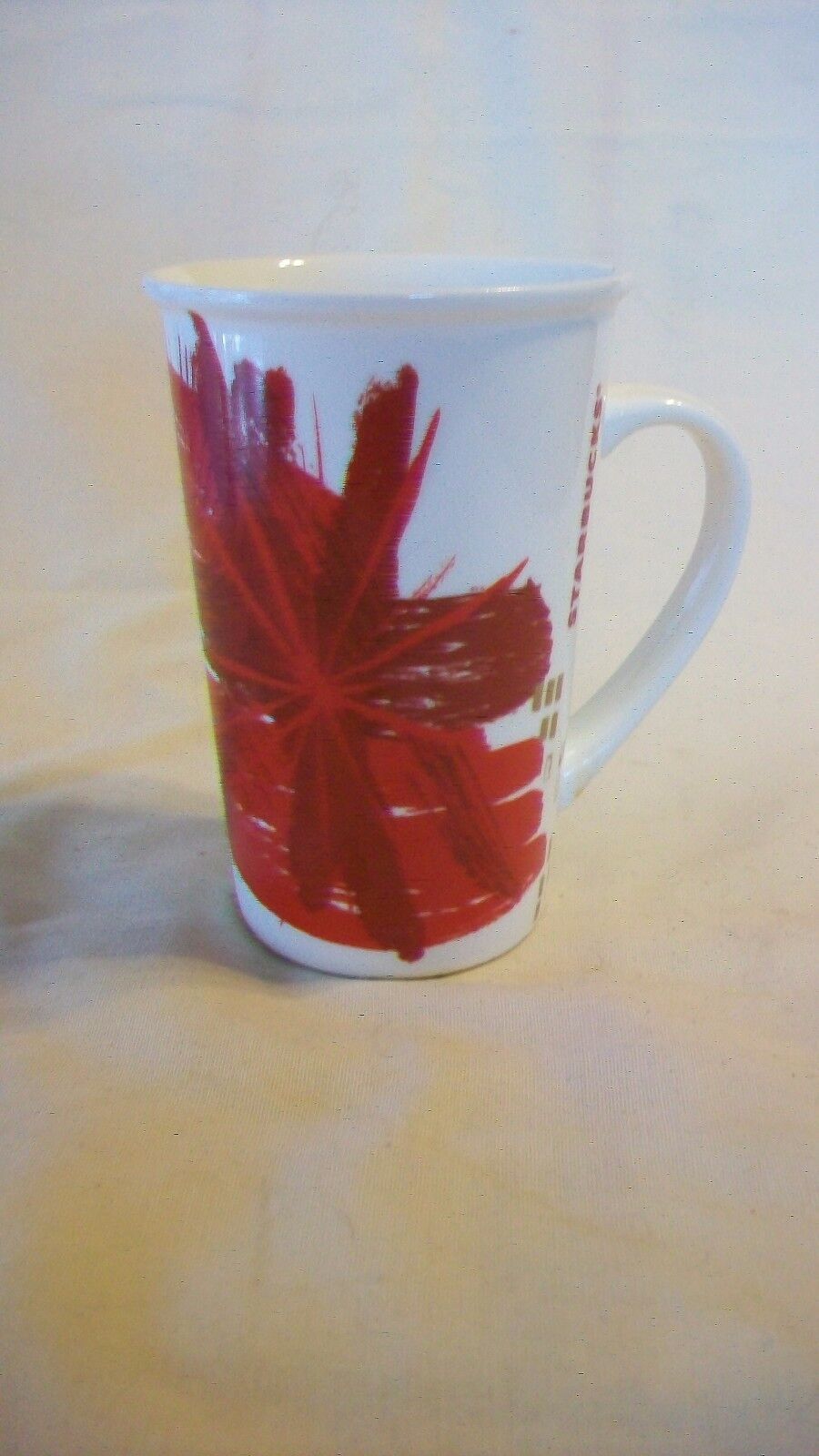 Primary image for Pair of 2014 Starbucks Red Splash Christmas Ceramic Coffee Mugs, holds 12 ounces
