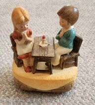 VTG Ceramic Boy Girl Couple Praying At Table Rotates Plays God Bless Ame... - $17.99