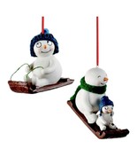 SLEDDING SNOWMAN ORNAMENTS Set of Two 2pcs Riding Sled Porcelain Christm... - $238.89 MXN