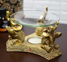 Ebros Feng Shui Golden Thai Buddha Elephants Trumpeting Candle Oil Warme... - €23,23 EUR
