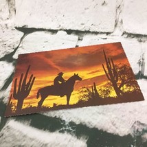 Vintage Postcard Desert Sunset Silhouette Of Cowboy  - $4.94