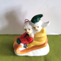 Mini Christmas Village Accessory/Ornament 2 Children Sledding Porcelain ... - $6.92