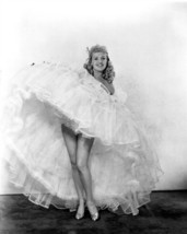 Betty Grable swirling her dress shows off legs 24x36 inch poster - £23.68 GBP