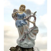 Vintage Porcelain Angel Figurine Playing Flute and Dove Iridescent Musician Gift - $43.87