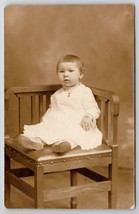 RPPC Adorable Little Child in White Dress Wearing Jewelry on Chair Postcard C25 - £7.15 GBP