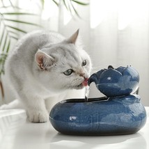 Pet Oasis: Resin Cat Feeder and Water Dispenser - $60.34+