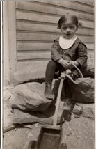 RPPC Sweet Child on Rocks With Toy Wagon Postcard Y18 - £10.97 GBP