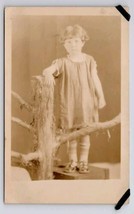 RPPC Adorable Little Girl On Crate Studio Prop Tree Real Photo Postcard C41 - £5.44 GBP