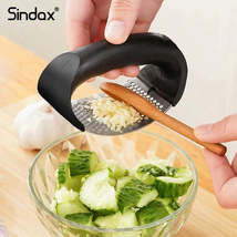 Stainless Steel Garlic Press and Chopper for Easy Kitchen Prep - $7.78