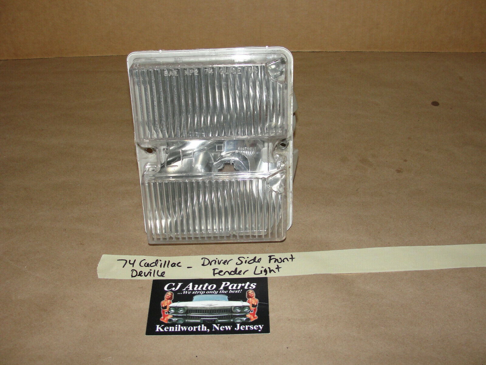 Primary image for 74 Cadillac Deville LEFT SIDE FRONT FENDER CORNER PARK TURN SIGNAL LIGHT LENS