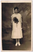 Postcard RPPC Sad Looking Young Lady In White Dress Big Bow &amp; Bouquet - $6.97