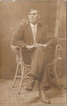 RPPC Clean Cut Man In Ornate Wicker Chair Studio Real Photo c1910 Postcard Y9 - £6.21 GBP